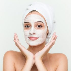 young-caucasian-woman-enjoying-offacial-mask-treatment_1187-23405